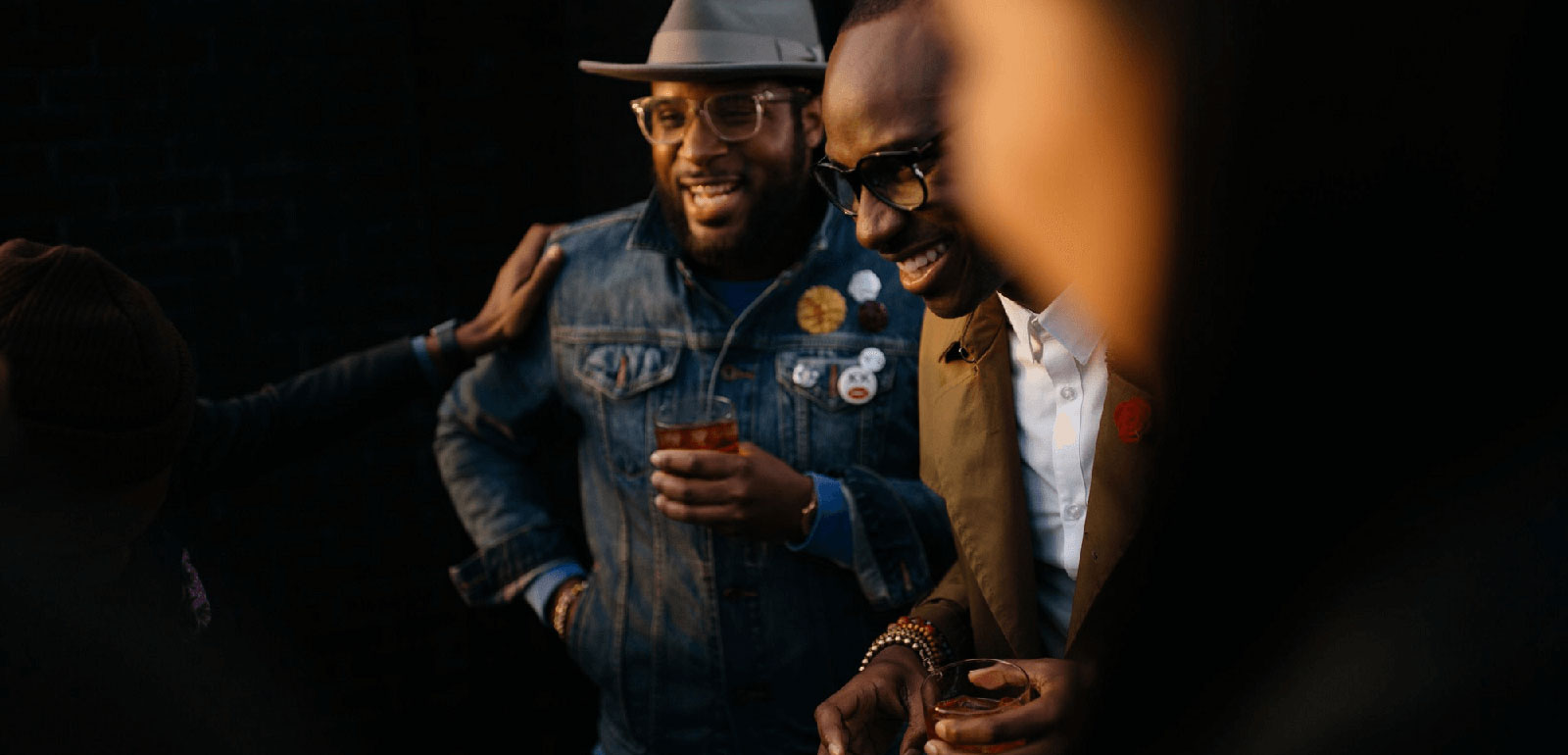 Friends enjoying a beer and laughing