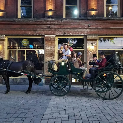 friends taking a historic carriage ride