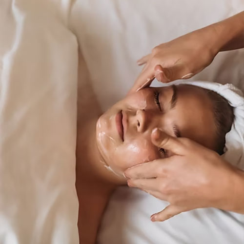 woman receiving a facial massage