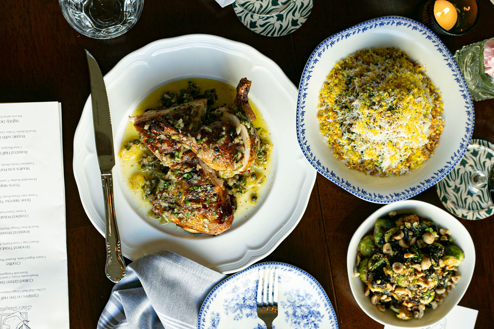 Chicken dinner with surrounding plates