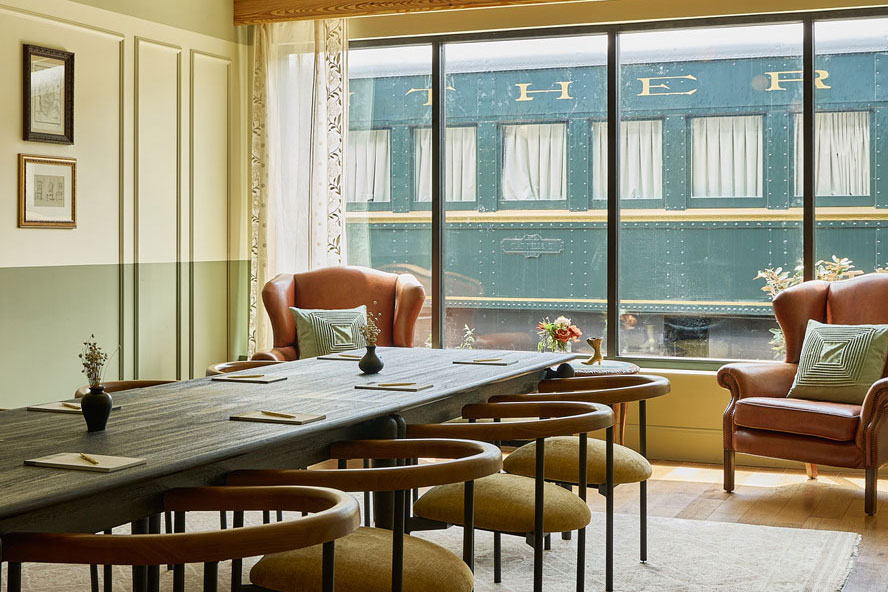 Boardroom with train outside window